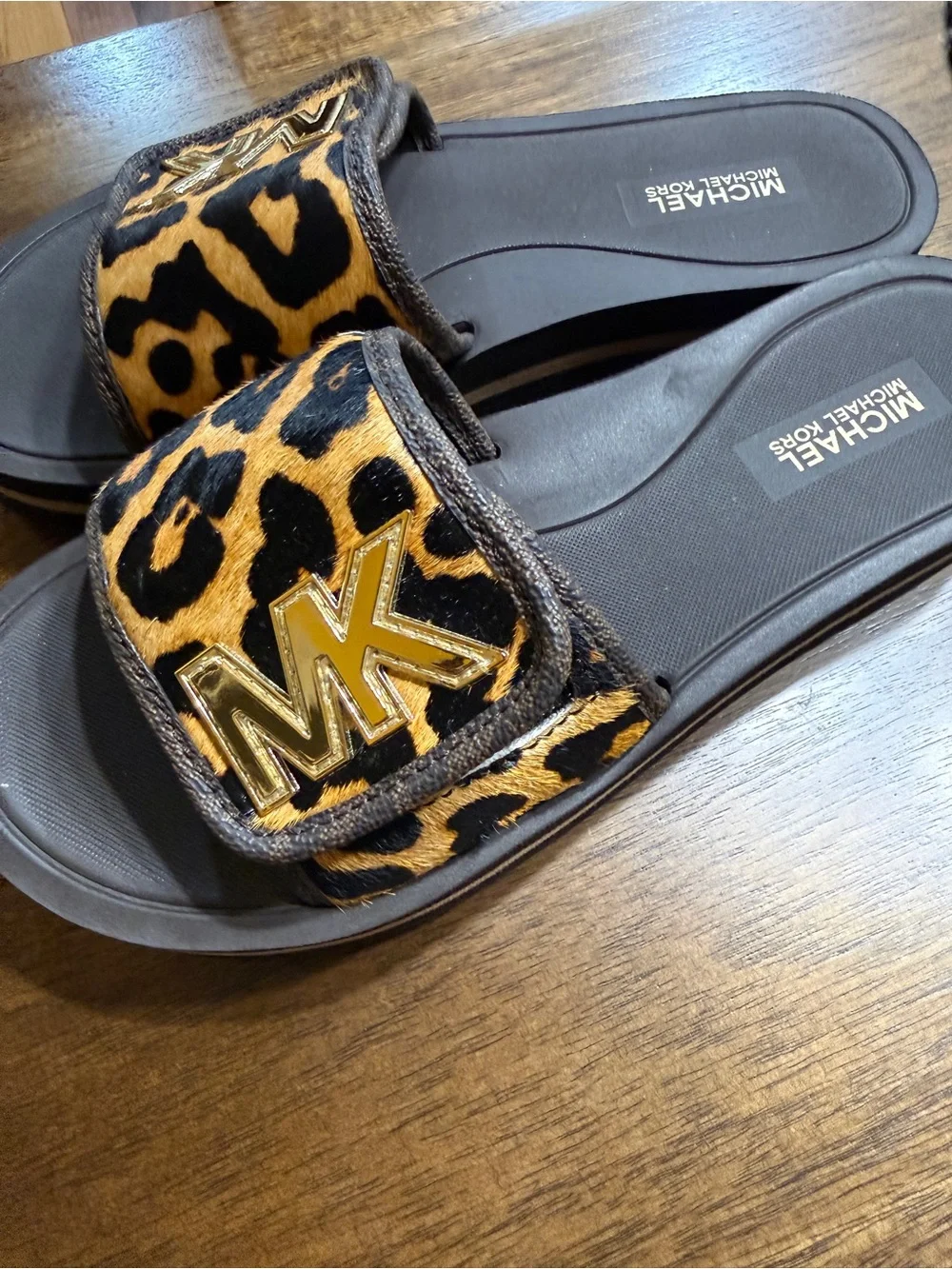 MICHAEL Michael Kors Black Footbed Leopard Print Slide Sandals with Gold MK Logo